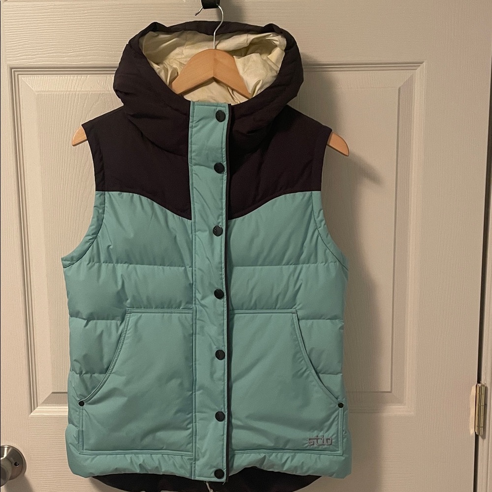 Stio Medium Blue and charcoal grey Turnbolt Down vest.